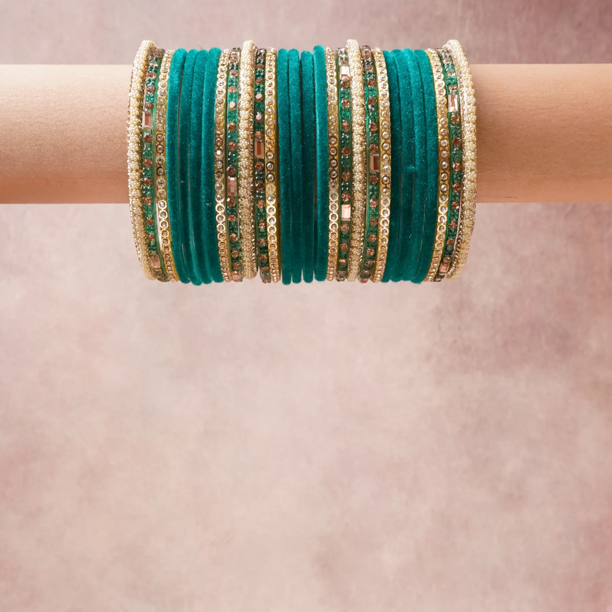 A grounding Teal forms the heart of the set, while touches of Gold, Cream Pearl, Champagne Crystal, Clear Crystal add charm.

A thoughtful composition of Velvet, Gold-Tone Metal, Faux Pearl, Crystal, designed to feel complete without being heavy.
Each element layers seamlessly, creating a look that is refined, wearable and quietly striking.